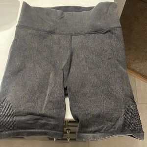 Grey biker shorts with detailing on the side
